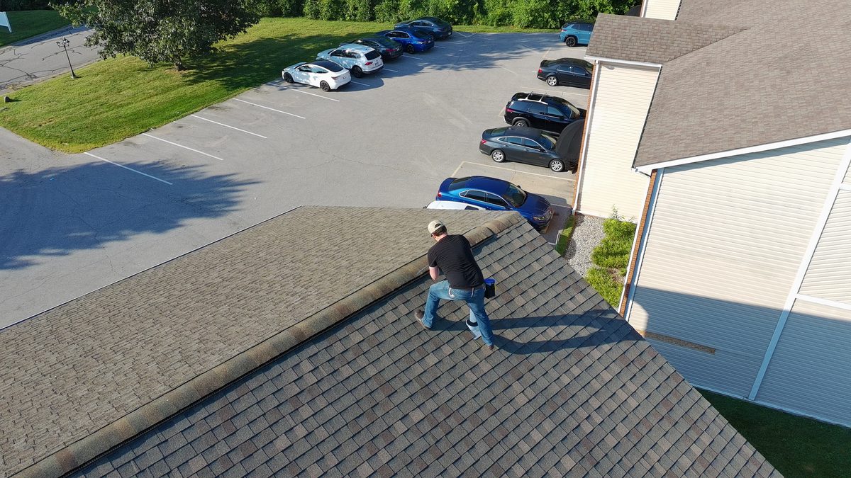 Vanguard adjuster performing a roof inspection